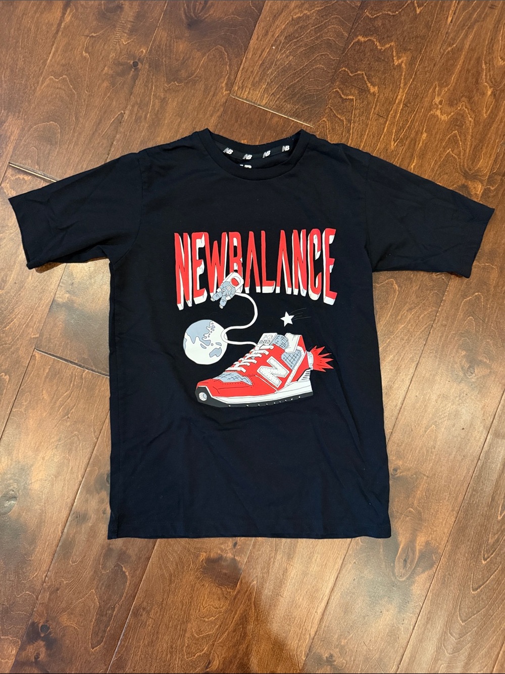 New Balance Black Tee with Red Sneaker Space Graphic
